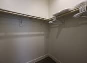 Thumbnail 69 of 73 - a walk in closet in a bedroom with grey walls and white trim at Scottsdale Hayden Townhomes, Arizona