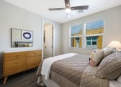 Thumbnail 61 of 73 - a bedroom with a large bed and a dresser with a mirror  at Scottsdale Hayden Townhomes, Arizona