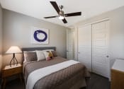 Thumbnail 66 of 73 - a bedroom with a bed and a ceiling fan  at Scottsdale Hayden Townhomes, Scottsdale, 85257