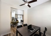 Thumbnail 44 of 73 - a room with a table and chairs and a ceiling fan  at Scottsdale Hayden Townhomes, Scottsdale, Arizona
