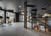 Thumbnail 54 of 81 - A room with a grey carpet and a black railing.