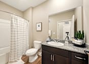 Thumbnail 26 of 33 - A bathroom with a toilet, sink, and shower. at Beau Chene Lake Charles Apartments, Apartments, Lake Charles, LA