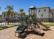 Thumbnail 10 of 12 - playground area at Beau Chene Lake Charles Apartments in Lake Charles, LA 70605
