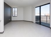 Thumbnail 16 of 81 - Spacious living room with neutral walls and ample natural light.