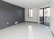 Thumbnail 59 of 81 - Spacious living room with neutral walls and ample natural light.