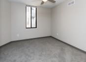 Thumbnail 68 of 81 - Spacious living room with neutral walls and ample natural light.