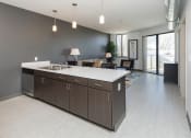 Thumbnail 77 of 81 - Modern open-concept kitchen and living area with stainless steel appliances.