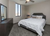 Thumbnail 78 of 81 - Bright, vacant bedroom with neutral walls and carpet flooring.
