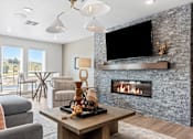 Thumbnail 39 of 44 - a living room with a fireplace and a television