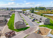 Thumbnail 64 of 64 - A residential area with houses and a playground.