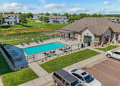 Thumbnail 13 of 31 - A large house with a pool in the backyard.