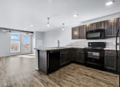 Thumbnail 2 of 35 - Kitchen overlooking into Living Room
