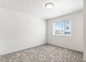 Thumbnail 6 of 44 - an empty room with carpet and a window