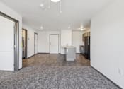 Thumbnail 3 of 21 - A spacious living room with a grey carpet and white walls.