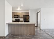 Thumbnail 4 of 21 - A kitchen with a countertop and appliances.