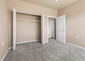 Thumbnail 15 of 40 - A room with a grey carpet and a white door.