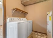 Thumbnail 38 of 64 - A laundry room with a washer and dryer.