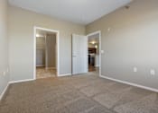Thumbnail 41 of 54 - A room with carpeted floor and two open doors.