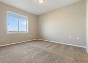 Thumbnail 42 of 54 - A room with a carpeted floor and a window.