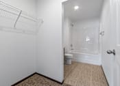 Thumbnail 36 of 58 - A white bathroom with a toilet, sink, and bathtub.