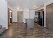 Thumbnail 26 of 57 - A modern kitchen with a refrigerator, sink, and cabinets.