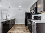 Thumbnail 9 of 35 - kitchen with black appliances