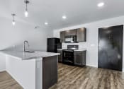 Thumbnail 10 of 35 - kitchen with black appliances