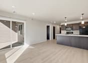 Thumbnail 31 of 68 - A modern kitchen with a white countertop and dark cabinets.