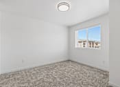 Thumbnail 12 of 44 - an empty room with carpet and a window