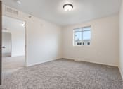 Thumbnail 41 of 50 - A room with a carpeted floor and a window.