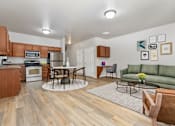 Thumbnail 2 of 60 - A kitchen with a dining table and chairs in the middle of the room.