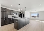 Thumbnail 46 of 68 - A modern kitchen with dark wood cabinets and a large island.