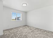Thumbnail 32 of 44 - an empty room with carpet and a window