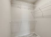 Thumbnail 53 of 68 - Empty white shelves in a room.