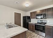 Thumbnail 4 of 55 - kitchen with black appliances