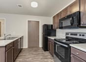 Thumbnail 6 of 55 - kitchen with black appliances