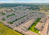 Thumbnail 46 of 46 - A bird's eye view of a residential area with houses and cars.
