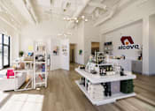 Thumbnail 41 of 41 - A white interior of a store with a sign that says Alcove.