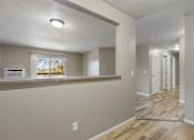 Thumbnail 31 of 41 - A room with a window and a wooden floor.
