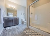 Thumbnail 13 of 29 - Modern bathroom featuring white oak vanity and walk-in shower