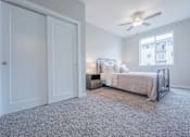 Thumbnail 23 of 29 - Modern bedroom featuring white oak accents and plenty of closet space