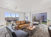 Thumbnail 10 of 20 - Spacious living room with neutral walls and ample natural light.