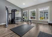 Thumbnail 25 of 46 - A spacious home gym with a variety of equipment.