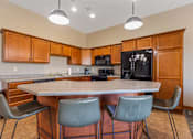 Thumbnail 28 of 64 - A kitchen with a table and chairs.