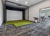 Thumbnail 41 of 58 - A room with a black and white patterned carpet and a green mat in front of a black screen.