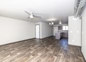 Thumbnail 66 of 81 - A room with a ceiling fan and wooden flooring.