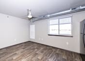 Thumbnail 70 of 81 - A room with a window and a fan on the ceiling.