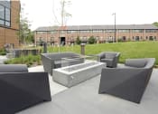 Thumbnail 3 of 81 - Outdoor kitchen area with barbecue and dining table.