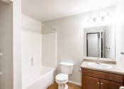 Thumbnail 15 of 15 - a bathroom with a sink toilet and a bath tub