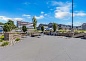 Thumbnail 43 of 81 - A sunny day at a residential complex with a clear blue sky.